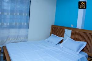 Postel nebo postele na pokoji v ubytování Chambre privée à Bafoussam Diengdam proche agence BlueBird