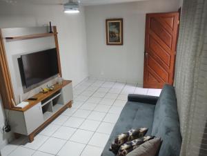 TV a/nebo společenská místnost v ubytování Casa em Itapoá