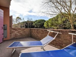 a blue trampoline sitting on a patio at Apartment Solmare-54 by Interhome in Rosapineta