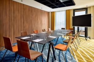 TV a/nebo společenská místnost v ubytování Courtyard by Marriott Lyon Eurexpo Stadium