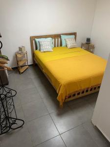 Postel nebo postele na pokoji v ubytování Le flamboyant