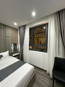 Postel nebo postele na pokoji v ubytování Seven Stars Hotel & Apartment