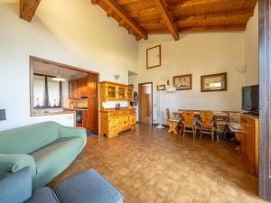 a living room with a couch and a dining room at Holiday Home Marzia by Interhome in Germignaga
