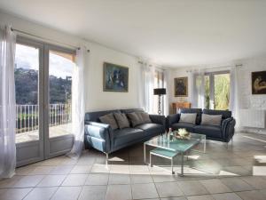 a living room with a couch and a table at Villa Villa Bellevue by Interhome in Saint Paul de Vence