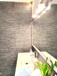 a bathroom with a sink and a mirror at Villa Aire in Cala en Blanes +34 photos