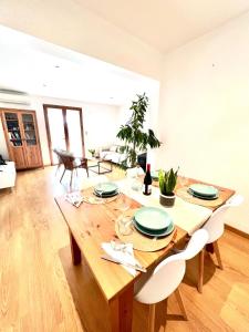 a dining room with a wooden table and chairs at Villa Aire in Cala en Blanes