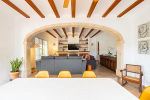 a living room with a couch and a table and chairs at VILLA HERBEN JAVEA - Golf Club Jávea in Jávea