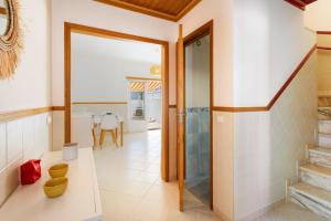 a bathroom with a walk in shower and a toilet at TAC - Serenity Manta Rota in Vila Nova De Cacela +19 photos