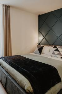 Ένα ή περισσότερα κρεβάτια σε δωμάτιο στο Albergo Caffe Centrale