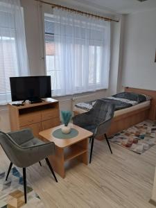 A television and/or entertainment centre at ŠD Urbánkova 2