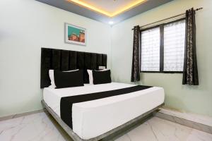 Una cama o camas en una habitación de Hotel O Dream Stay