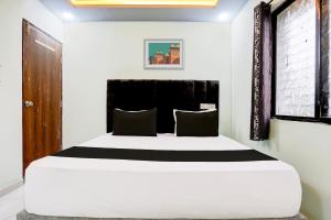 Una cama o camas en una habitación de Hotel O Dream Stay