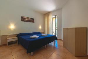 Postel nebo postele na pokoji v ubytování Residence Pietre Bianche ApartHotel