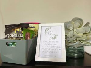 a box of chocolates and a sign on a table at Scenic Countryside Lodge Romantic & Pet-Friendly in Newcastle West +15 photos