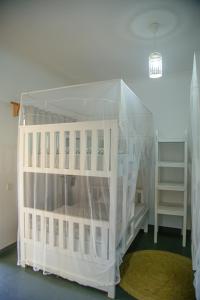 a white doll house in a room at Hakuna in Arusha