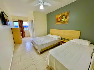 Postel nebo postele na pokoji v ubytování HOTEL GUAIRACÁ