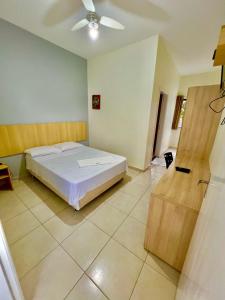 Postel nebo postele na pokoji v ubytování HOTEL GUAIRACÁ