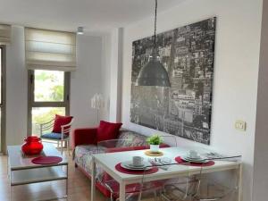 a living room with a couch and a table at Aldaba by Huskalia in Los Llanos de Aridane