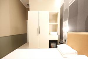 A bed or beds in a room at The B Place