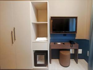 A television and/or entertainment centre at The B Place