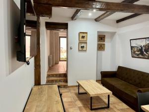 a living room with a couch and a table at La Mirada de Juana in Tordesillas