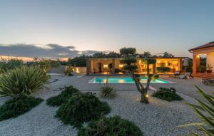 a house with a swimming pool in a yard at Villa St. Anna in Radetići - Haus für 8 Personen in Radetići