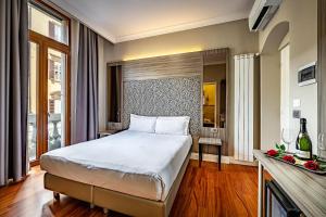 a bedroom with a large bed in a room at B&B Residenza le Fonticine in Florence +50 photos