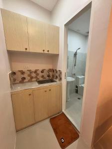 a small bathroom with a sink and a toilet at ZV Homes in Tagbilaran City