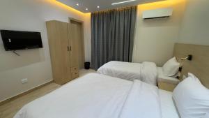 Letto o letti in una camera di Landmark Hostel Cairo