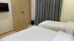 Letto o letti in una camera di Landmark Hostel Cairo