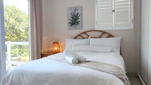 Postel nebo postele na pokoji v ubytování Shore Break 12 Gleneagles , Salt Rock + 28 fotografií