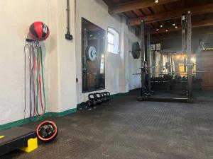 a gym with a bunch of equipment in a room at Lawki Booking in Ławki
