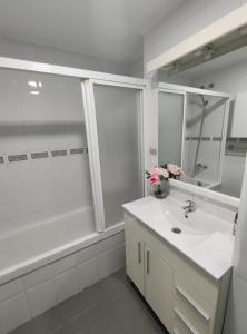 a white bathroom with a sink and a shower at Hikari&Sineida Home in Rincón de la Victoria +28 photos