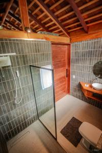a bathroom with a shower and a toilet at Cirandeira Amazon World EcoResort in Manacapuru +94 photos