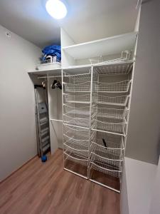 a walk in closet with metal shelving at Spacious Retreat in Oslo