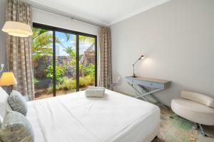 Кровать или кровати в номере Villa Sandpiper - Premium Stay in the North