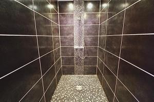 a bathroom with a walk in shower with tiled walls at Pied-à-terre - Apartment 75m2 - free parking in Oullins +24 photos