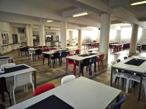 an empty dining room with tables and chairs at ŠD Němcovej 1 in Košice