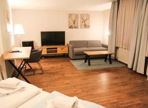 TV a/nebo společenská místnost v ubytování Hotel Simonis Koblenz