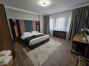 Postel nebo postele na pokoji v ubytování Hotel Yarus