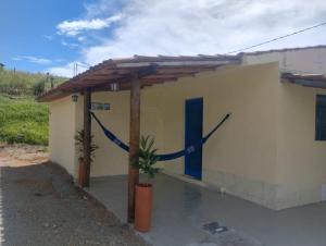 a building with a clock on the side of it at Cantinho da Paz in Socorro