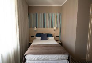 Posteľ alebo postele v izbe v ubytovaní Hotel Cristal Białystok