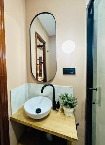 a bathroom with a sink and a mirror at Autentic Boutique Moncloa in Madrid
