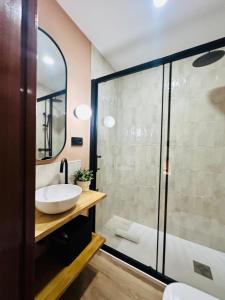 a bathroom with a sink and a shower at Autentic Boutique Moncloa in Madrid