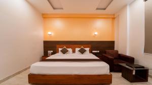 Postel nebo postele na pokoji v ubytování Hotel Bhaskar