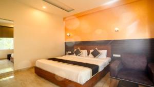 Postel nebo postele na pokoji v ubytování Hotel Bhaskar