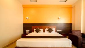 Postel nebo postele na pokoji v ubytování Hotel Bhaskar