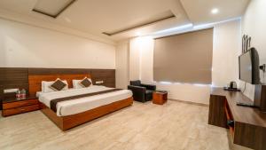 Postel nebo postele na pokoji v ubytování Hotel Bhaskar