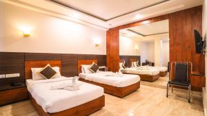 Postel nebo postele na pokoji v ubytování Hotel Bhaskar