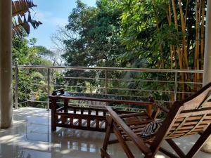 a couple of chairs sitting on a porch at sisi place in Dickwella +15 photos
